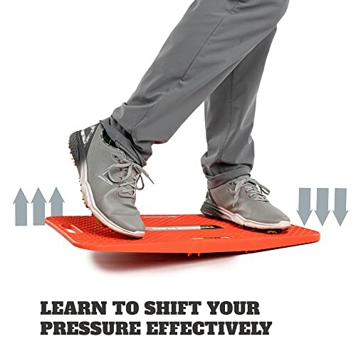 Person using a red balance training board.
