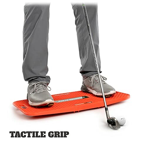 Person using a golf swing trainer balance board.